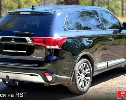 Черный Мицубиси Аутлендер, объемом двигателя 2 л и пробегом 150 тыс. км за 15900 $, фото 3 на Automoto.ua