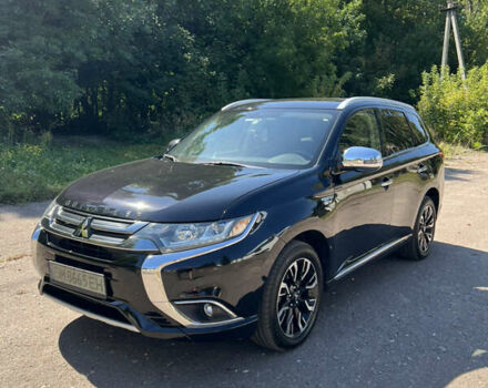 Черный Мицубиси Аутлендер, объемом двигателя 2 л и пробегом 54 тыс. км за 21500 $, фото 1 на Automoto.ua