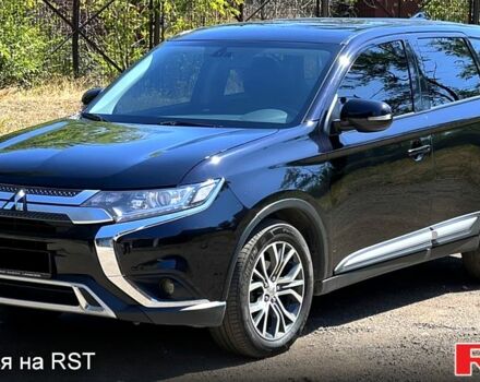 Черный Мицубиси Аутлендер, объемом двигателя 2 л и пробегом 150 тыс. км за 15900 $, фото 1 на Automoto.ua