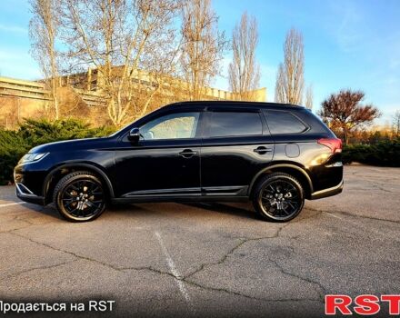 Черный Мицубиси Аутлендер, объемом двигателя 2.4 л и пробегом 130 тыс. км за 16499 $, фото 2 на Automoto.ua