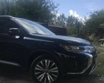 Черный Мицубиси Аутлендер, объемом двигателя 2.4 л и пробегом 125 тыс. км за 11200 $, фото 2 на Automoto.ua