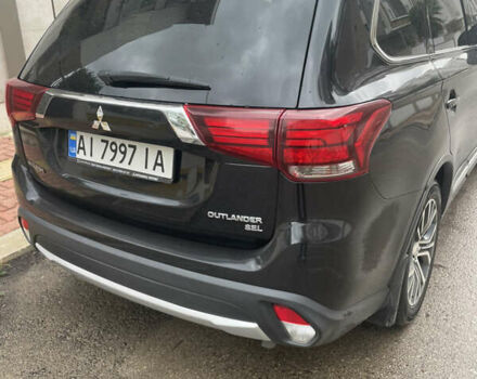 Чорний Міцубісі Аутлендер, об'ємом двигуна 2.4 л та пробігом 180 тис. км за 15500 $, фото 1 на Automoto.ua