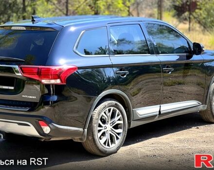 Черный Мицубиси Аутлендер, объемом двигателя 2 л и пробегом 150 тыс. км за 15900 $, фото 2 на Automoto.ua