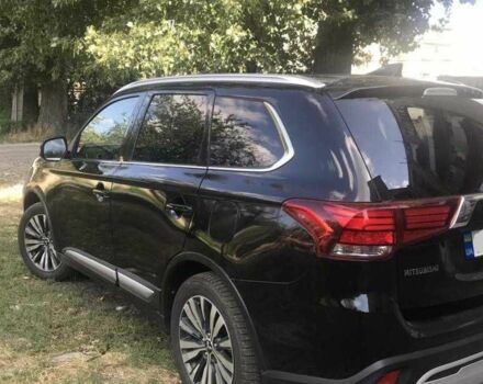 Черный Мицубиси Аутлендер, объемом двигателя 2.4 л и пробегом 125 тыс. км за 11200 $, фото 4 на Automoto.ua