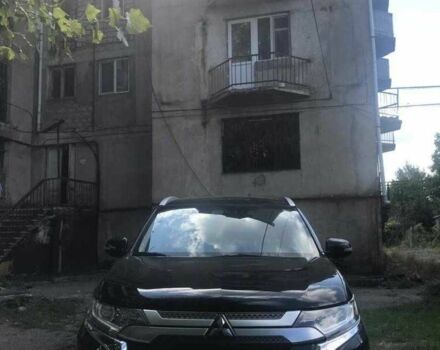 Черный Мицубиси Аутлендер, объемом двигателя 2.4 л и пробегом 125 тыс. км за 11200 $, фото 1 на Automoto.ua
