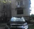 Черный Мицубиси Аутлендер, объемом двигателя 2.4 л и пробегом 125 тыс. км за 11200 $, фото 1 на Automoto.ua