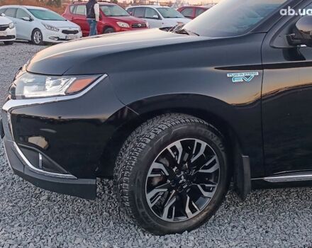 Черный Мицубиси Аутлендер, объемом двигателя 2 л и пробегом 115 тыс. км за 23700 $, фото 1 на Automoto.ua