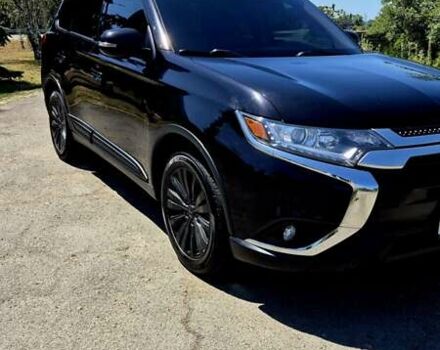 Черный Мицубиси Аутлендер, объемом двигателя 2.36 л и пробегом 200 тыс. км за 17299 $, фото 2 на Automoto.ua