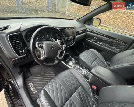 Черный Мицубиси Аутлендер, объемом двигателя 2 л и пробегом 148 тыс. км за 21800 $, фото 22 на Automoto.ua