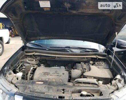 Черный Мицубиси Аутлендер, объемом двигателя 2.36 л и пробегом 135 тыс. км за 2800 $, фото 5 на Automoto.ua