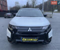 Черный Мицубиси Аутлендер, объемом двигателя 2.4 л и пробегом 53 тыс. км за 32900 $, фото 1 на Automoto.ua