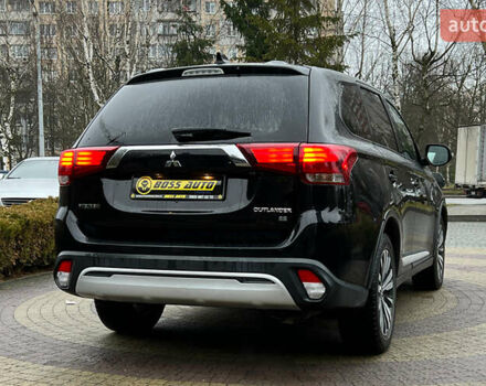 Черный Мицубиси Аутлендер, объемом двигателя 2.36 л и пробегом 144 тыс. км за 16900 $, фото 6 на Automoto.ua