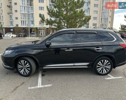 Черный Мицубиси Аутлендер, объемом двигателя 2.36 л и пробегом 90 тыс. км за 26500 $, фото 1 на Automoto.ua