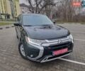 Черный Мицубиси Аутлендер, объемом двигателя 2.36 л и пробегом 127 тыс. км за 20800 $, фото 1 на Automoto.ua