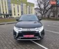 Черный Мицубиси Аутлендер, объемом двигателя 2.36 л и пробегом 127 тыс. км за 20800 $, фото 1 на Automoto.ua
