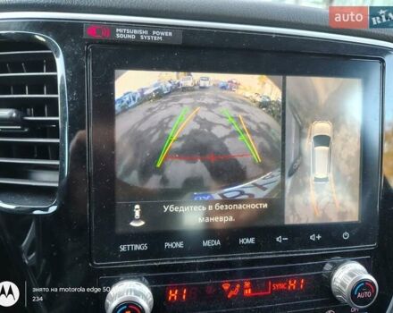 Черный Мицубиси Аутлендер, объемом двигателя 2.36 л и пробегом 50 тыс. км за 21000 $, фото 1 на Automoto.ua