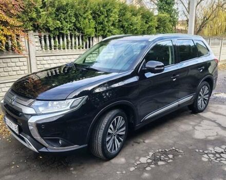 Черный Мицубиси Аутлендер, объемом двигателя 2.36 л и пробегом 50 тыс. км за 21000 $, фото 2 на Automoto.ua