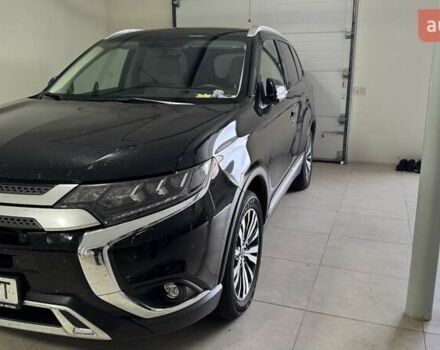 Черный Мицубиси Аутлендер, объемом двигателя 2.36 л и пробегом 60 тыс. км за 25000 $, фото 1 на Automoto.ua