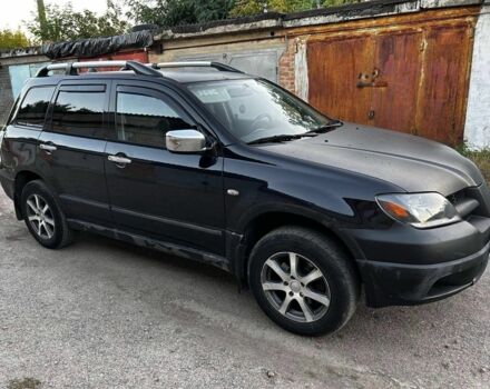 Черный Мицубиси Аутлендер, объемом двигателя 2 л и пробегом 390 тыс. км за 2500 $, фото 1 на Automoto.ua