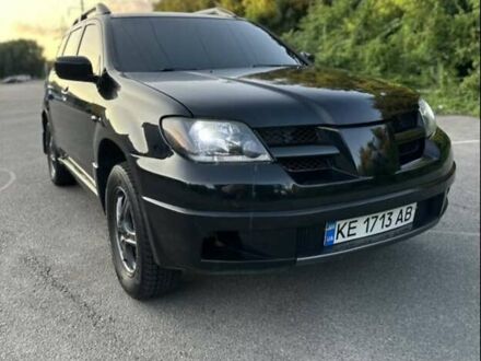 Черный Мицубиси Аутлендер, объемом двигателя 2.38 л и пробегом 212 тыс. км за 4800 $, фото 1 на Automoto.ua