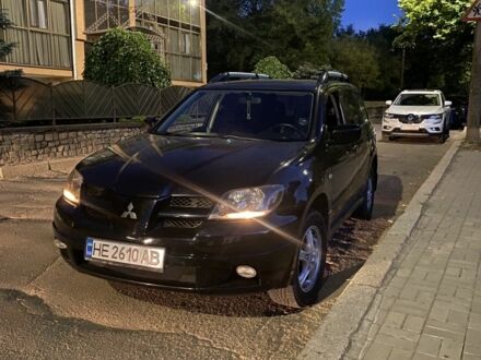 Чорний Міцубісі Аутлендер, об'ємом двигуна 2.4 л та пробігом 312 тис. км за 6500 $, фото 1 на Automoto.ua