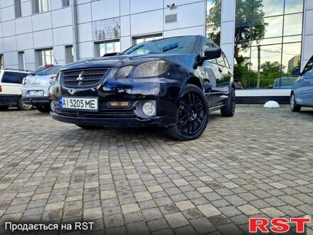 Чорний Міцубісі Аутлендер, об'ємом двигуна 2 л та пробігом 143 тис. км за 8500 $, фото 1 на Automoto.ua