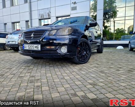 Черный Мицубиси Аутлендер, объемом двигателя 2 л и пробегом 143 тыс. км за 8500 $, фото 1 на Automoto.ua