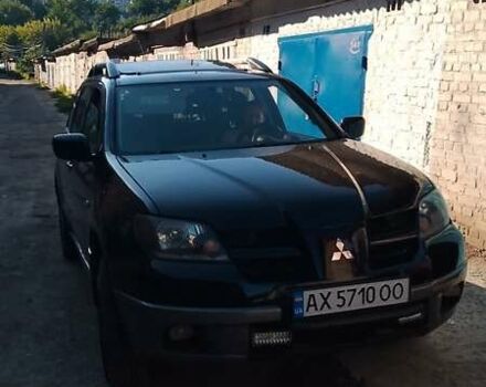 Чорний Міцубісі Аутлендер, об'ємом двигуна 2.38 л та пробігом 275 тис. км за 6000 $, фото 1 на Automoto.ua