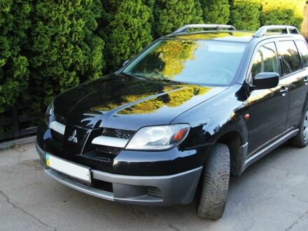 Чорний Міцубісі Аутлендер, об'ємом двигуна 2 л та пробігом 251 тис. км за 4990 $, фото 1 на Automoto.ua