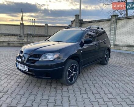 Черный Мицубиси Аутлендер, объемом двигателя 2.38 л и пробегом 294 тыс. км за 4550 $, фото 1 на Automoto.ua