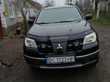 Чорний Міцубісі Аутлендер, об'ємом двигуна 2 л та пробігом 395 тис. км за 5200 $, фото 1 на Automoto.ua