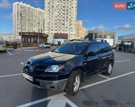Черный Мицубиси Аутлендер, объемом двигателя 2.4 л и пробегом 351 тыс. км за 4999 $, фото 1 на Automoto.ua