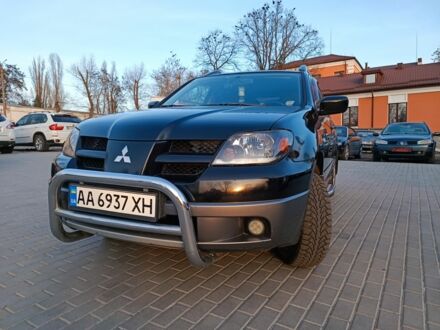 Чорний Міцубісі Аутлендер, об'ємом двигуна 2.4 л та пробігом 204 тис. км за 6733 $, фото 1 на Automoto.ua