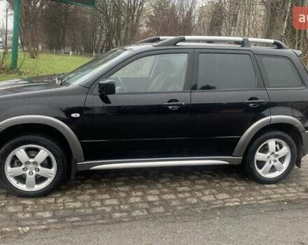 Черный Мицубиси Аутлендер, объемом двигателя 2 л и пробегом 300 тыс. км за 6500 $, фото 1 на Automoto.ua