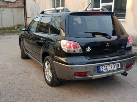 Черный Мицубиси Аутлендер, объемом двигателя 2.4 л и пробегом 243 тыс. км за 1846 $, фото 1 на Automoto.ua
