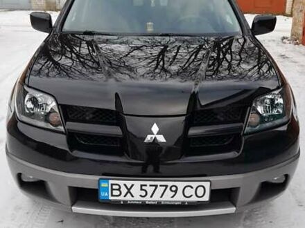 Черный Мицубиси Аутлендер, объемом двигателя 2 л и пробегом 243 тыс. км за 5500 $, фото 1 на Automoto.ua