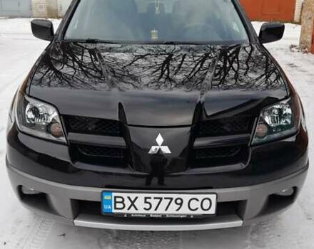 Черный Мицубиси Аутлендер, объемом двигателя 2 л и пробегом 243 тыс. км за 5500 $, фото 1 на Automoto.ua