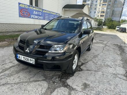 Чорний Міцубісі Аутлендер, об'ємом двигуна 2.4 л та пробігом 300 тис. км за 4100 $, фото 1 на Automoto.ua