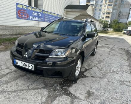Чорний Міцубісі Аутлендер, об'ємом двигуна 2.4 л та пробігом 300 тис. км за 4100 $, фото 1 на Automoto.ua