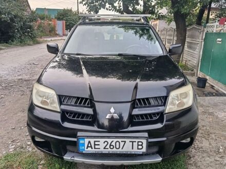 Чорний Міцубісі Аутлендер, об'ємом двигуна 2.4 л та пробігом 130 тис. км за 7300 $, фото 1 на Automoto.ua