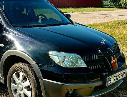 Мицубиси Аутлендер 2005 в Семеновка на Automoto.ua Черный Мицубиси Аутлендер, объемом двигателя 2.4 л и пробегом 230 тыс. км за 5600 $, фото 1 на Automoto.ua