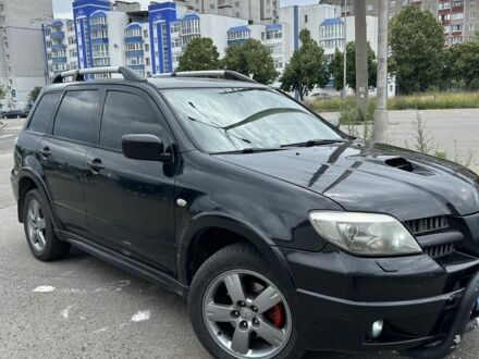 Мицубиси Аутлендер 2005 в Чернигове на Automoto.ua Черный Мицубиси Аутлендер, объемом двигателя 2 л и пробегом 266 тыс. км за 6500 $, фото 1 на Automoto.ua