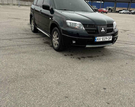 Черный Мицубиси Аутлендер, объемом двигателя 2.38 л и пробегом 190 тыс. км за 6800 $, фото 1 на Automoto.ua