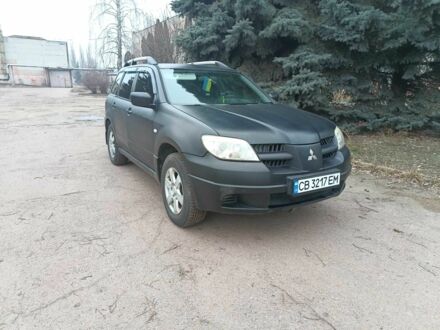 Черный Мицубиси Аутлендер, объемом двигателя 2 л и пробегом 495 тыс. км за 4400 $, фото 1 на Automoto.ua