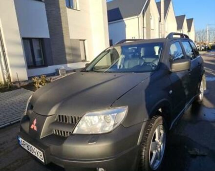 Черный Мицубиси Аутлендер, объемом двигателя 2.38 л и пробегом 357 тыс. км за 7400 $, фото 1 на Automoto.ua