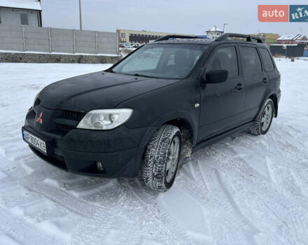 Черный Мицубиси Аутлендер, объемом двигателя 2.4 л и пробегом 359 тыс. км за 6299 $, фото 1 на Automoto.ua