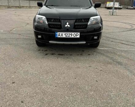 Черный Мицубиси Аутлендер, объемом двигателя 2.4 л и пробегом 190 тыс. км за 6800 $, фото 1 на Automoto.ua