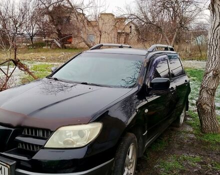 Чорний Міцубісі Аутлендер, об'ємом двигуна 2 л та пробігом 217 тис. км за 3900 $, фото 1 на Automoto.ua