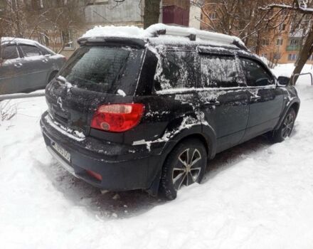 Черный Мицубиси Аутлендер, объемом двигателя 2.4 л и пробегом 250 тыс. км за 3350 $, фото 1 на Automoto.ua