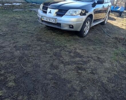 Чорний Міцубісі Аутлендер, об'ємом двигуна 2.4 л та пробігом 370 тис. км за 4800 $, фото 1 на Automoto.ua